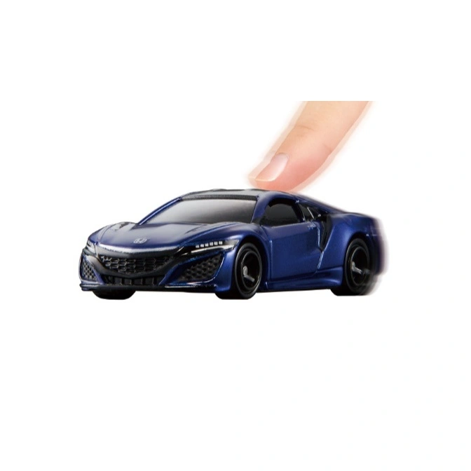Blue toy Honda NSX with a finger on top, suggesting it's being pushed or played with.