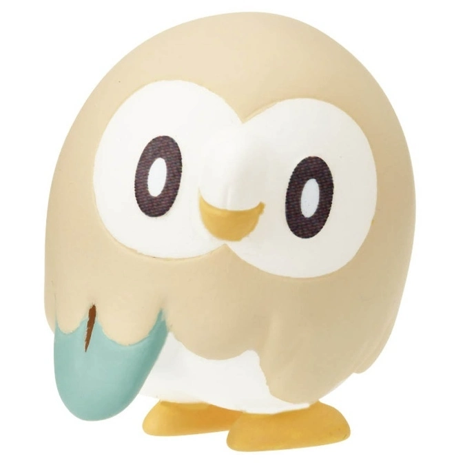 Rowlet Pokémon toy figure with big eyes and a small yellow beak.