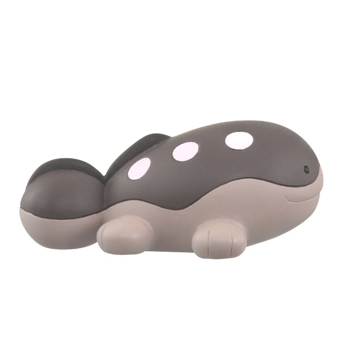  Grey whale toy with white spots and small flippers.