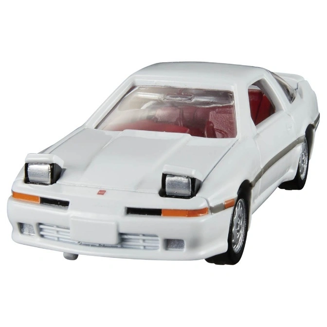  White Toyota Supra toy car with pop-up headlights and red interior.