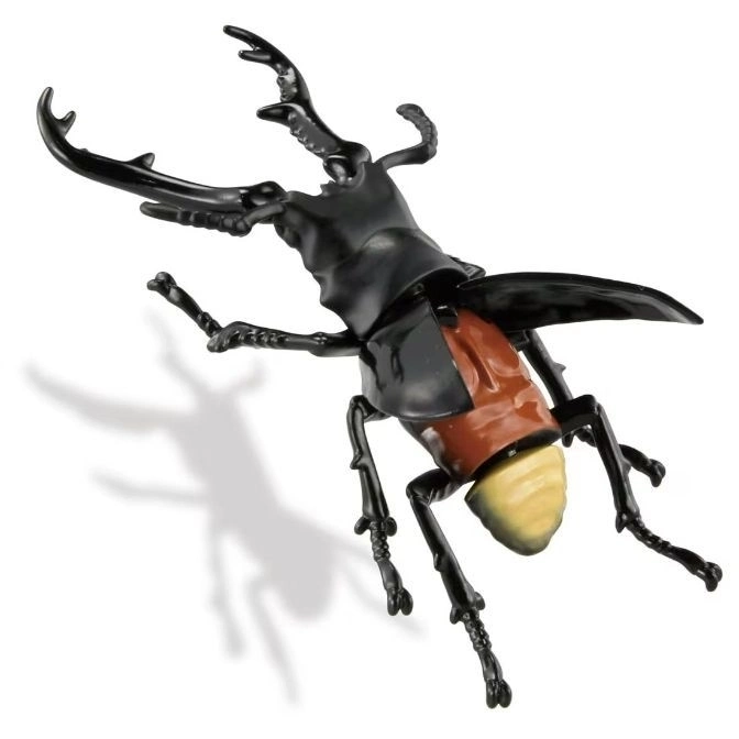  Toy stag beetle with large mandibles, black head and legs, and brown and yellow body.