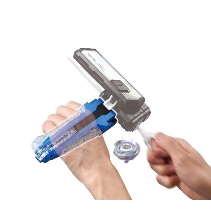 Beyblade X launcher in use, spinning top launching from the device.