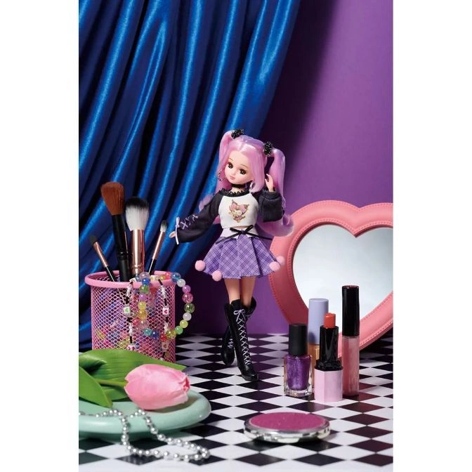  Doll with pink hair, purple skirt, and makeup accessories on a checkered surface.