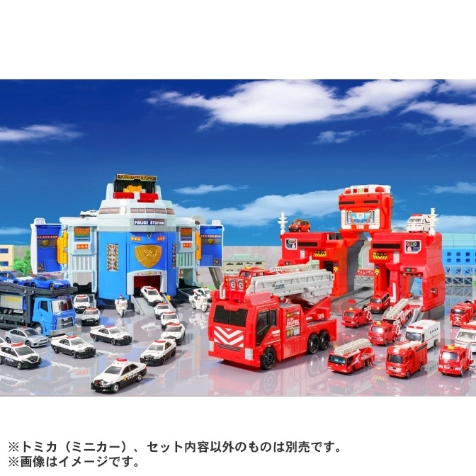  Toy police station and fire station playset with toy cars and trucks.