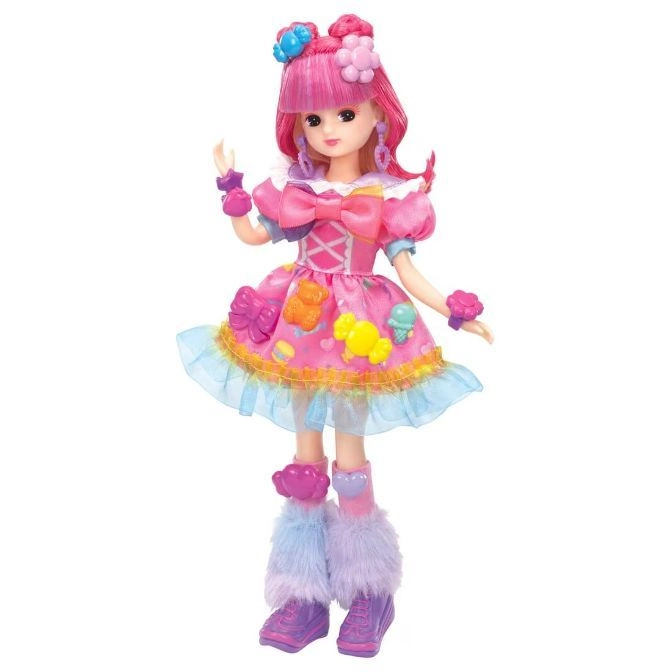 Pink-haired doll in a candy-themed dress with bows, ruffles, and fuzzy boots.