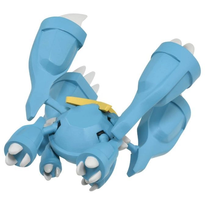  Blue toy monster with large claws and white spikes.