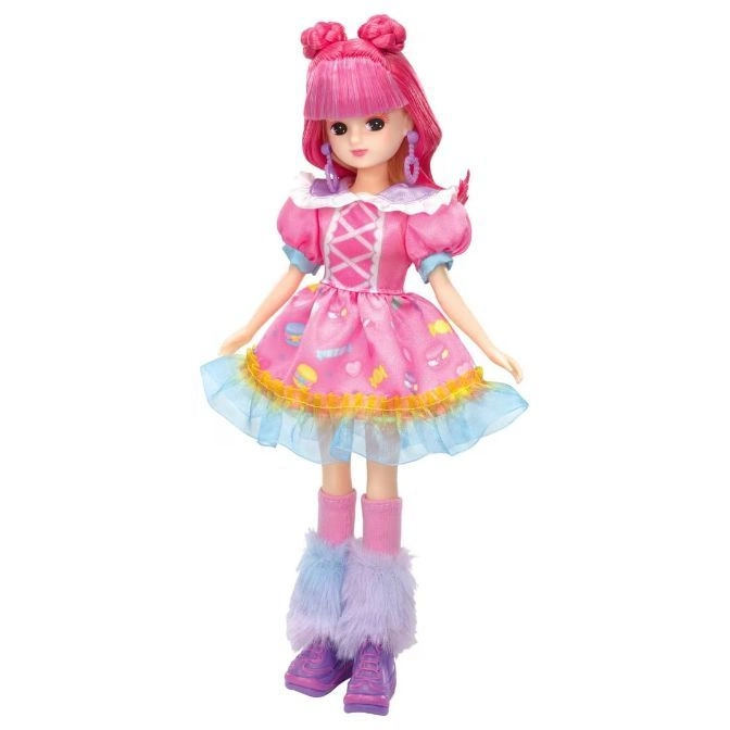  Pink-haired doll in a pink dress with cupcake accents, furry leg warmers, and purple sneakers.