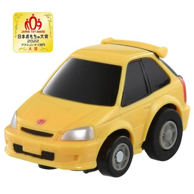 Yellow toy car with spoiler, black windows, and chunky tires. Japan Toy Award logo visible.