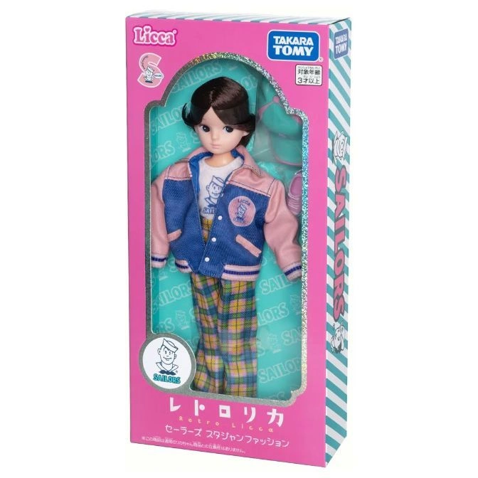  Licca doll in a pink box wearing a blue jacket and plaid pants.
