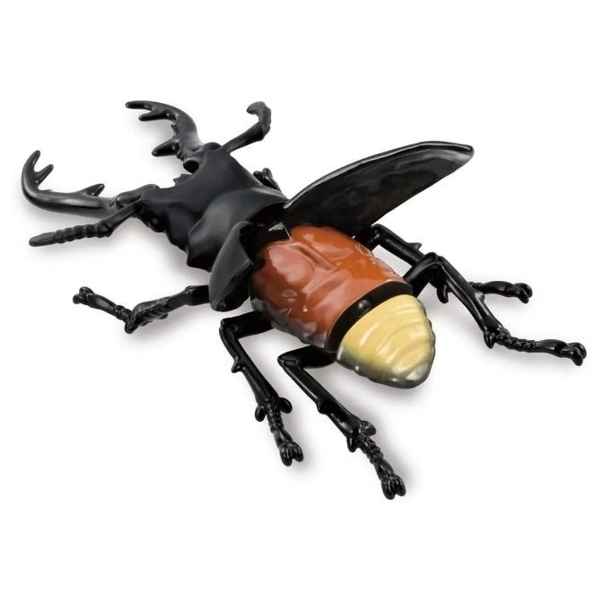  Toy stag beetle with black head and legs, brown and yellow abdomen, and large mandibles.
