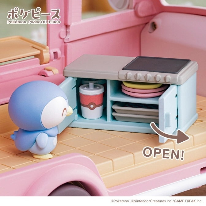  Pokémon Peaceful Place toy with Piplup. Cabinet door is open revealing plates and a drink.