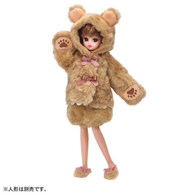  Doll wearing a bear costume with paw prints and pink bows.