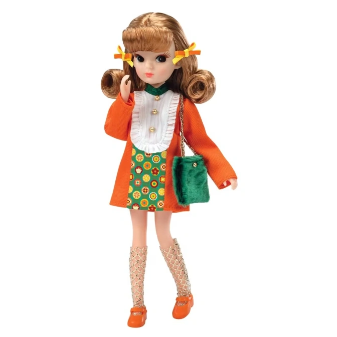 Licca-chan doll in orange dress, green bag, and orange shoes with bows.