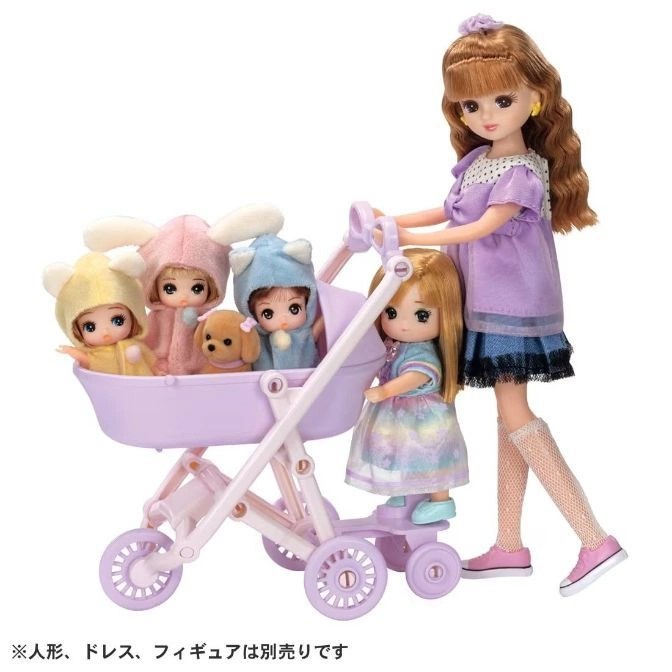  Doll pushing stroller with baby dolls and a toy dog.