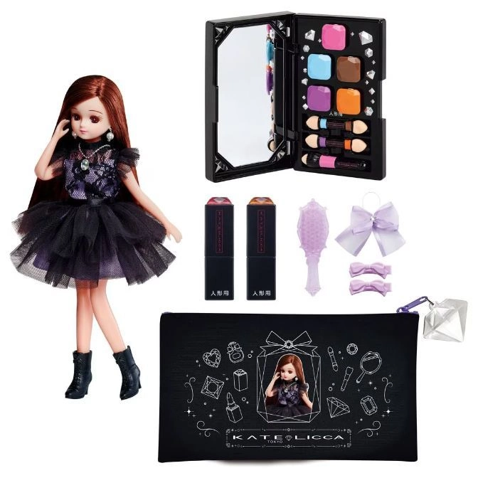 Licca doll in black dress with makeup kit, lipsticks, brush, bows, and pouch. A fashion doll with accessories.