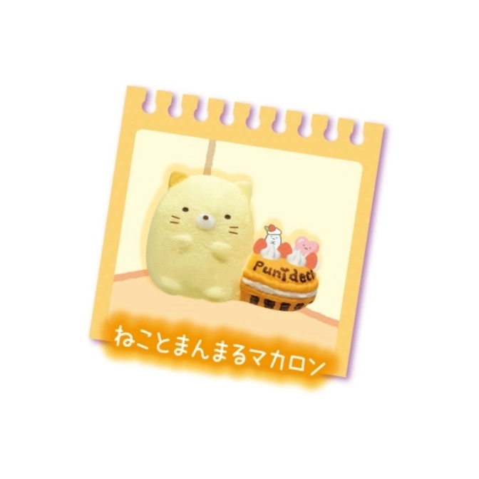  Yellow cat squishy toy and a cake squishy with 'Punideco' text on a yellow notepad background.