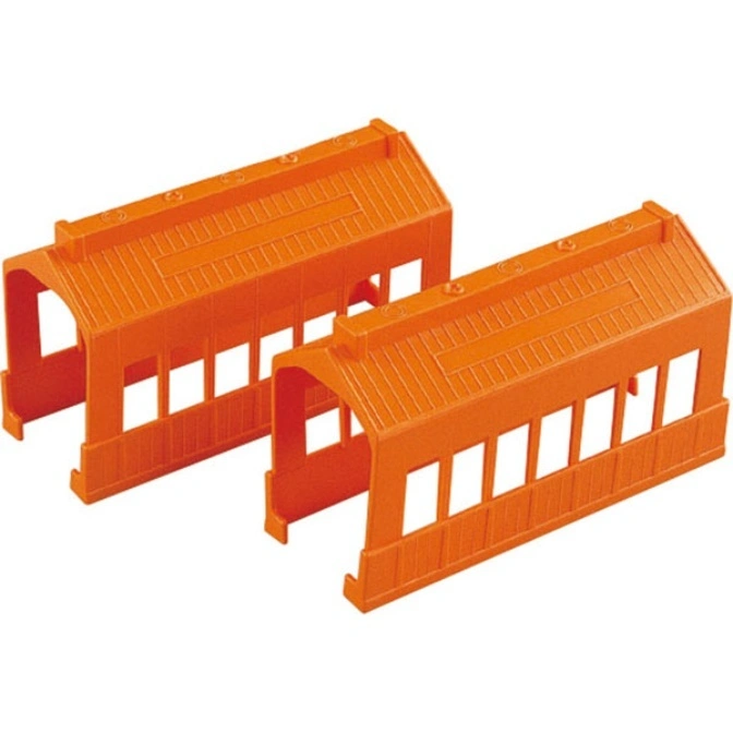 Two orange toy train tunnels with rectangular openings on the sides.
