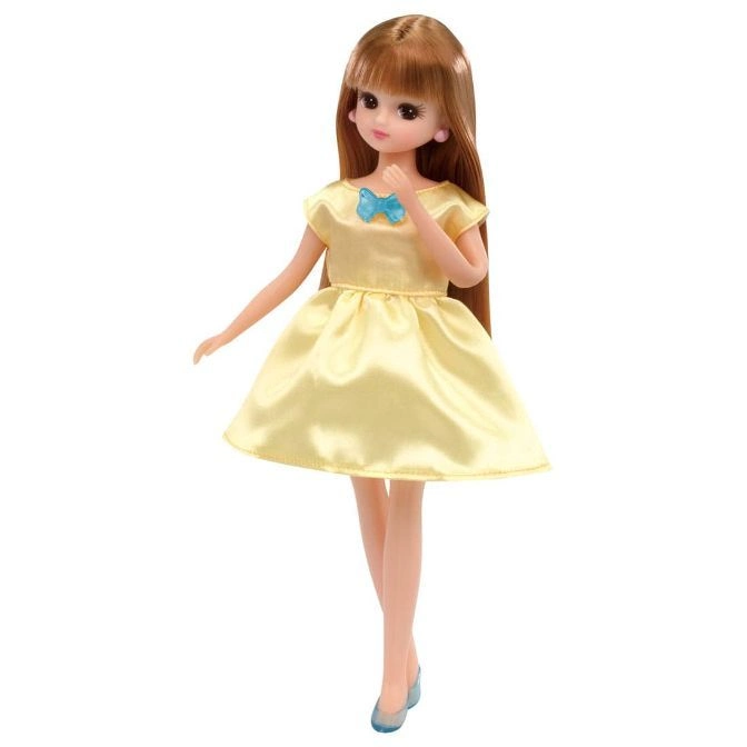  Licca-chan doll in a yellow dress with a blue bow and matching shoes.