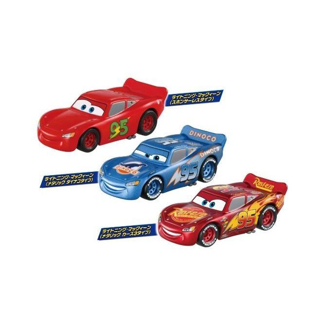 Three toy Lightning McQueen cars: red, blue Dinoco, and Rust-eze versions.