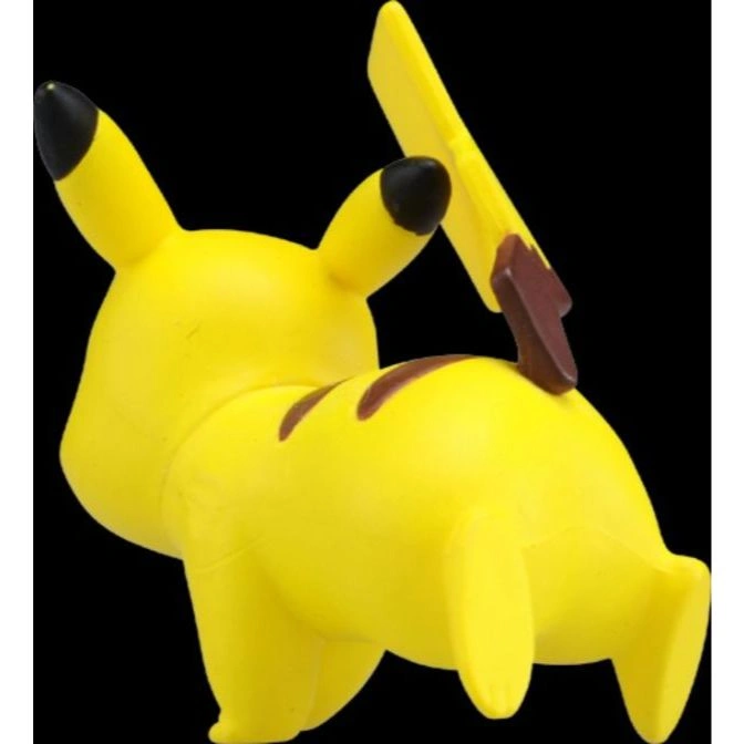  Yellow Pikachu toy with black-tipped ears and a lightning bolt tail, viewed from the back.
