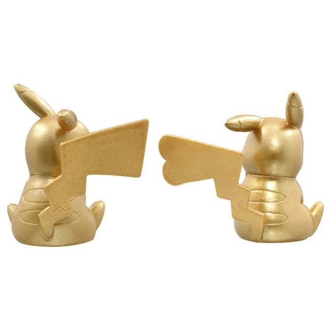  Two golden Pikachu figurines with lightning bolt tails facing away from each other.