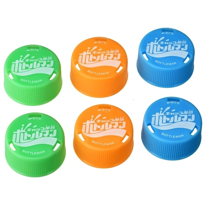 Bottleman toy caps in green, orange, and blue with Japanese text and slots.