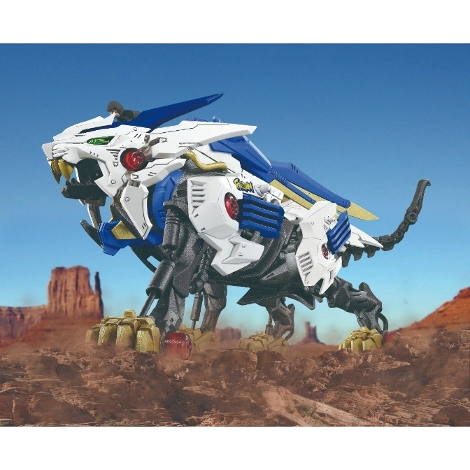  Zoids Liger Zero toy figure in a desert setting, white and blue armor, gold claws.