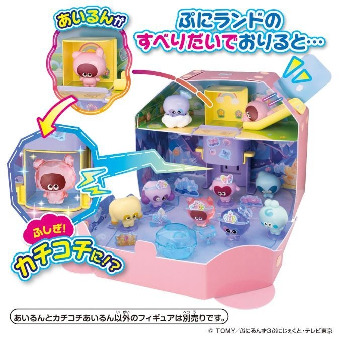 Pink toy playset with figures sliding down a ramp. Includes characters and crystal accessories.
