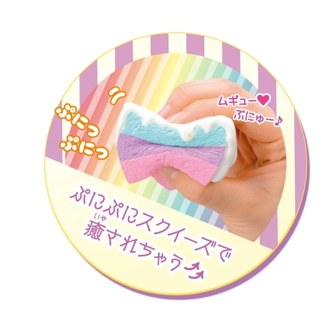  Rainbow squishy toy being squeezed. Pastel colors, kawaii style.