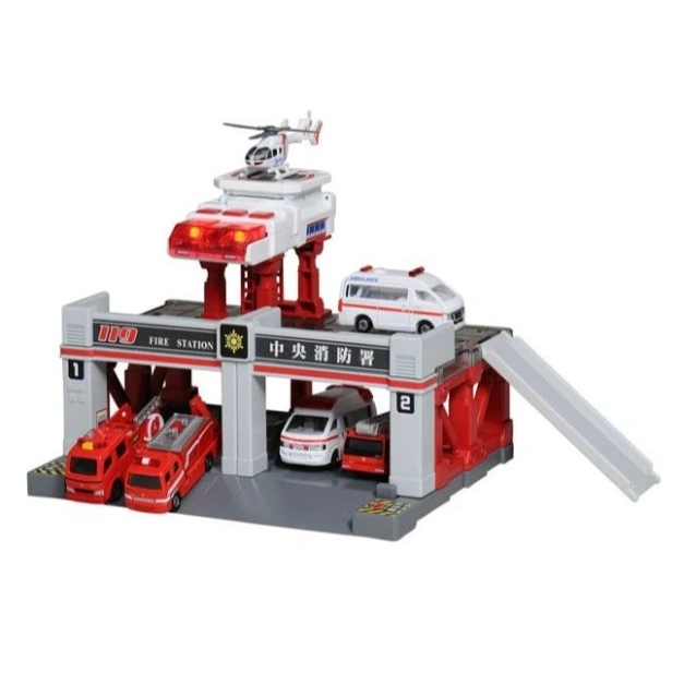 Toy fire station with fire trucks, ambulance, and helicopter on top.