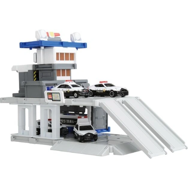  Toy police station with three toy police cars and ramps.