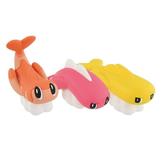  Sushi-shaped toys: orange shrimp, pink tuna, and yellow fish on white rice.