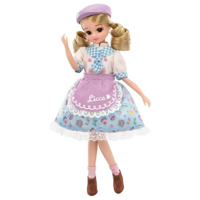  Licca doll in a baker's outfit with a beret, apron, and cupcake-themed dress.