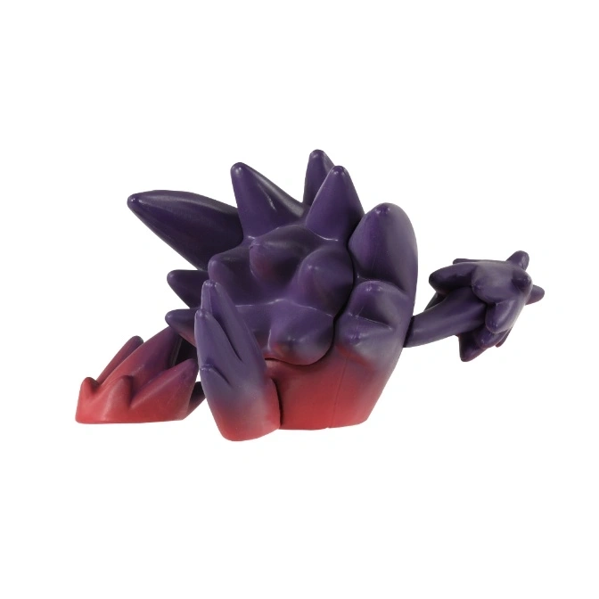  Purple and red spiky toy figure with arm extended.