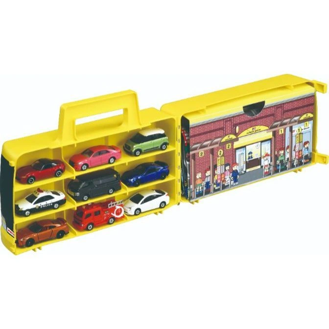  Yellow toy car carrier case with toy cars and a bus station backdrop.