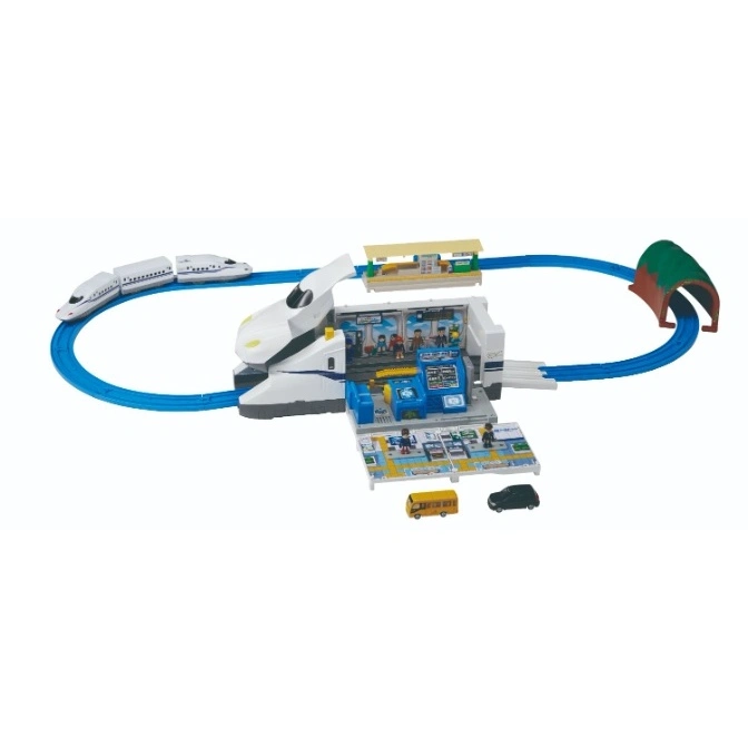  Toy train set with a bullet train, station, track, tunnel, bus, and car.