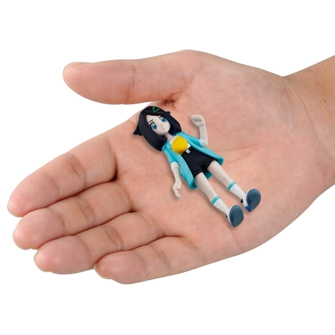  Small anime figure with blue hair and jacket lying in a hand.