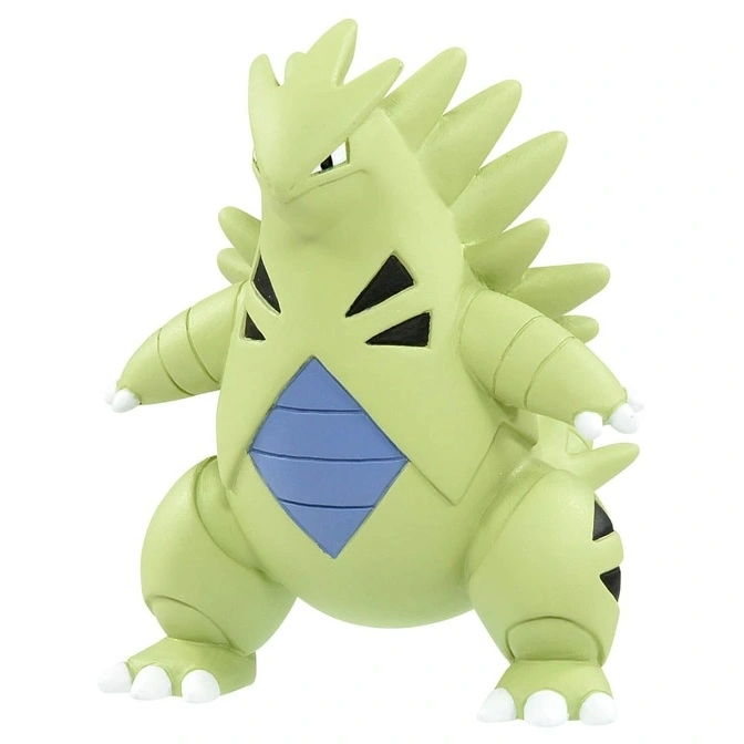 Green Tyranitar toy figure with blue chest plate and spiky back.