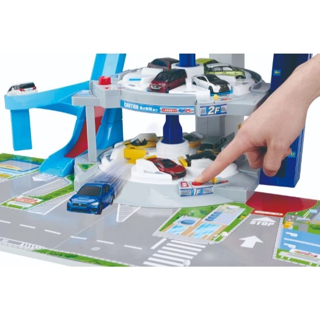  Toy car park with cars, hand pressing button. Multi-level with ramps and parking spaces.