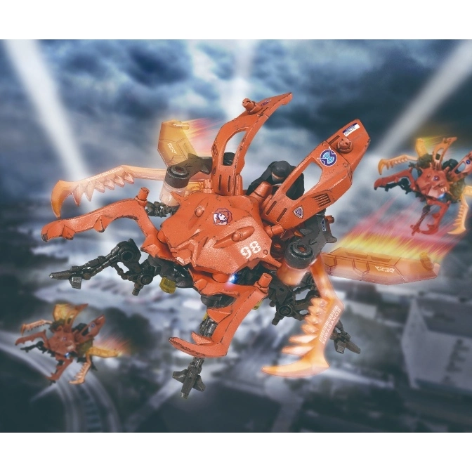  Orange robotic stag beetle toy with claws and guns, flying with motion blur effects.