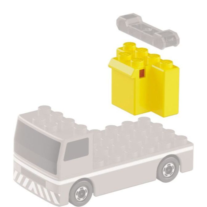  Toy truck with yellow building blocks and a gray connector piece above, ready to be assembled.