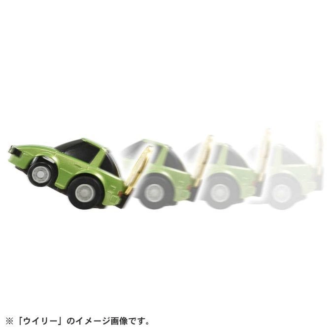  Green toy car doing a wheelie, shown in motion blur.