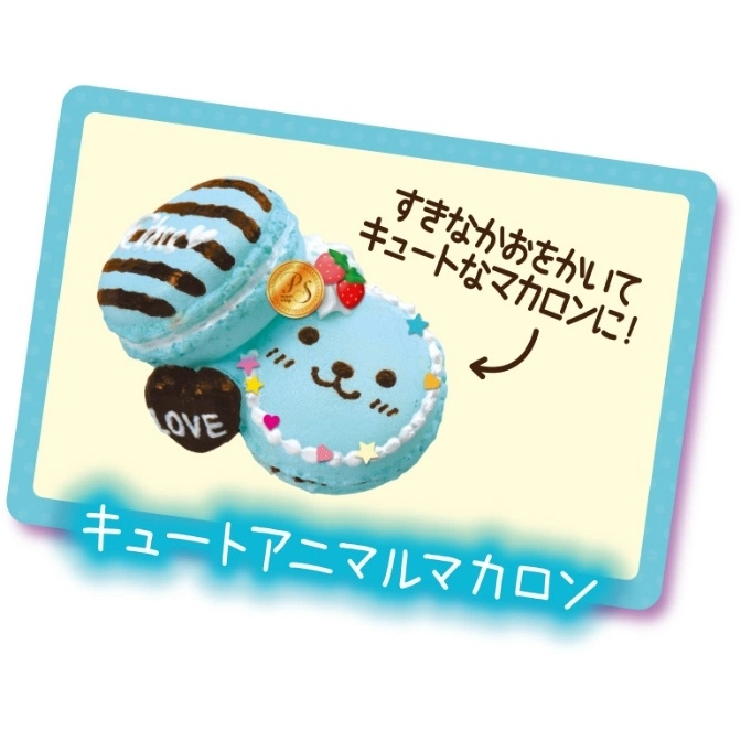  Blue animal macaron toy with chocolate heart and strawberry decorations.
