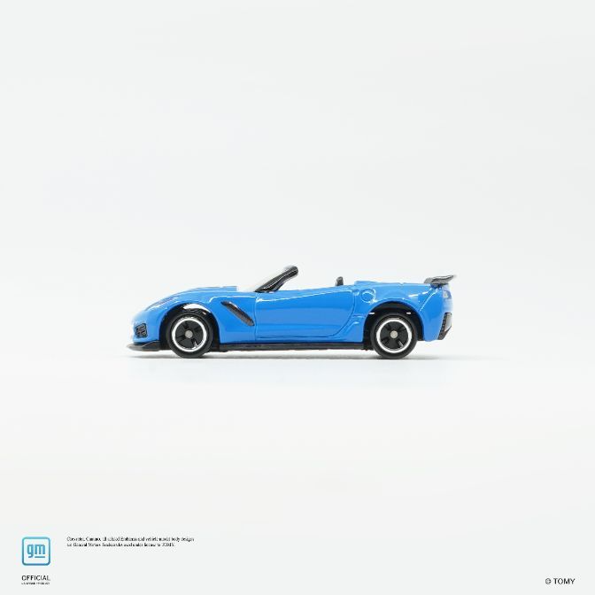  Blue Corvette convertible toy car with black wheels and spoiler on a white background.