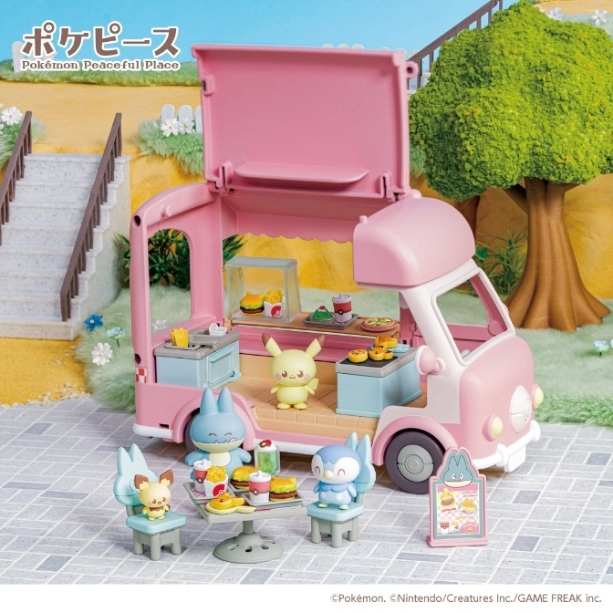  Pokémon Peaceful Place food truck toy set with figures, table, chairs, and menu board.
