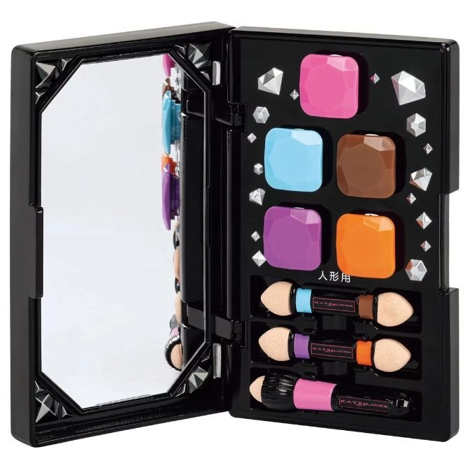  Open toy makeup kit with mirror, colorful eyeshadows, applicators, and diamond accents.