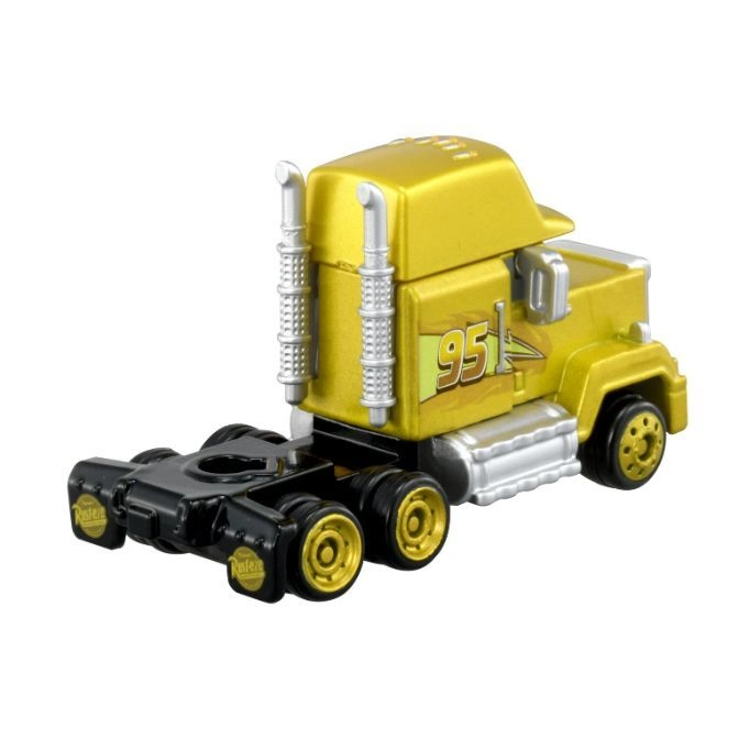  Gold Mack truck toy with black trailer and '95' decal.