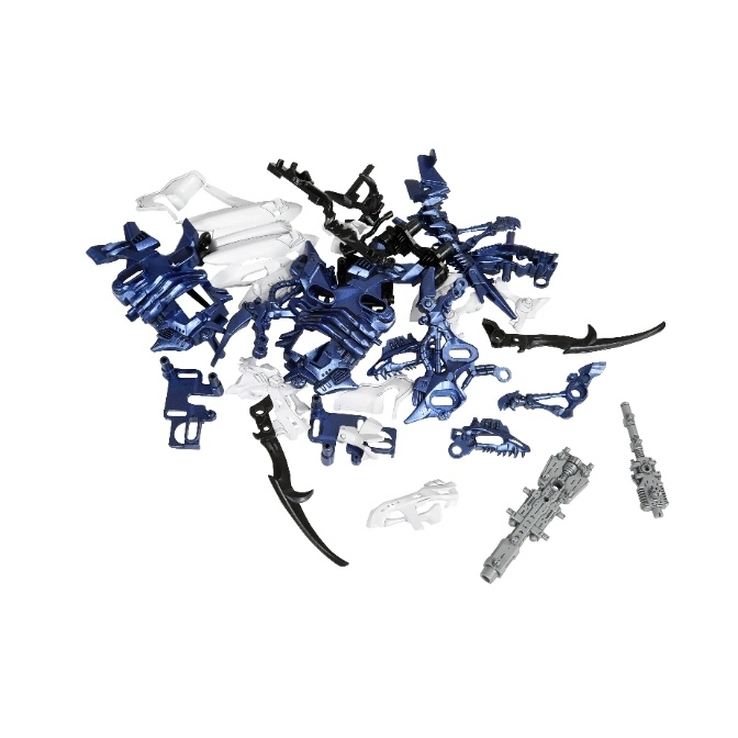  Pile of Bionicle toy parts in blue, white, black, and gray, including weapons and armor pieces.