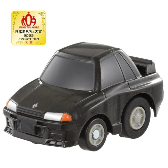 Black toy car, Japan Toy Award badge visible, stylized design.