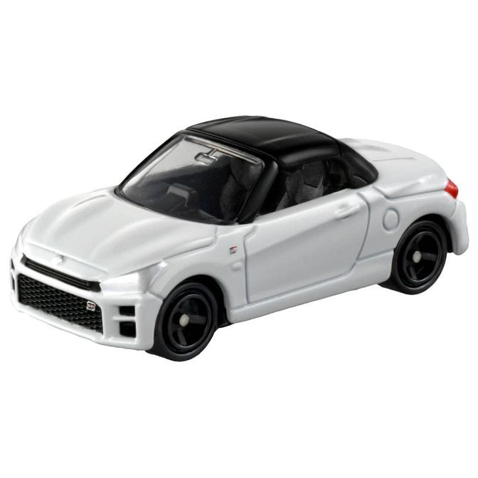 White toy car with black top and wheels, a miniature replica.